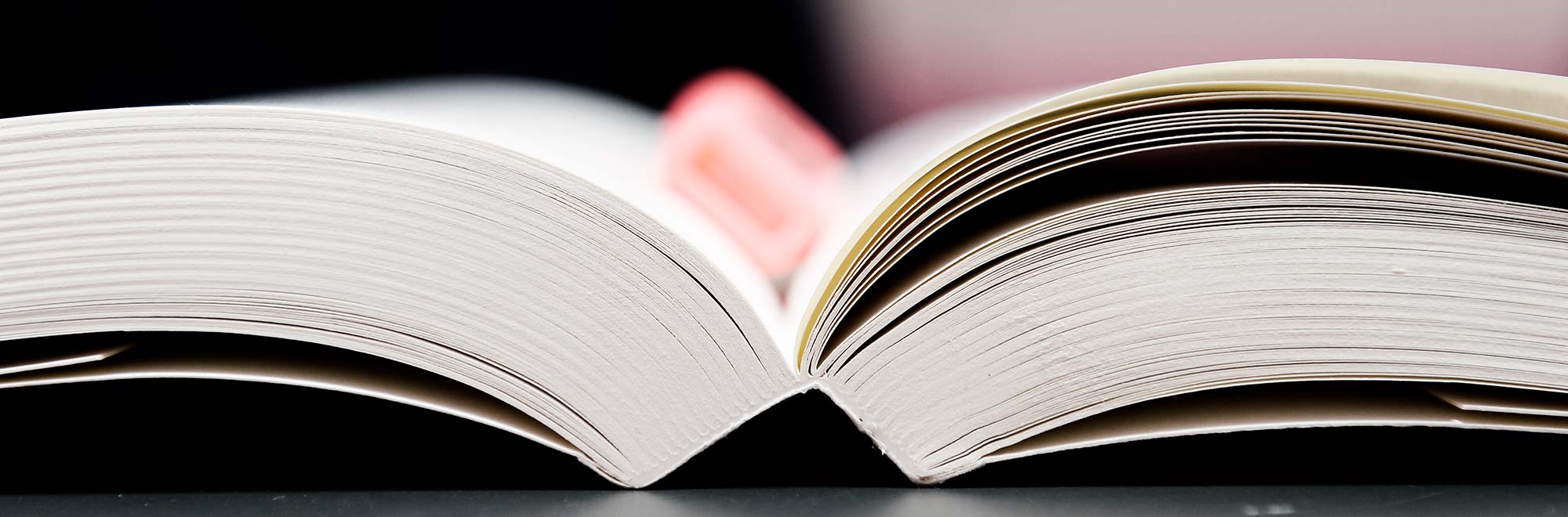 CBS open book with a pencil laying on the book